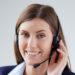 Young businesswoman with headset working in office